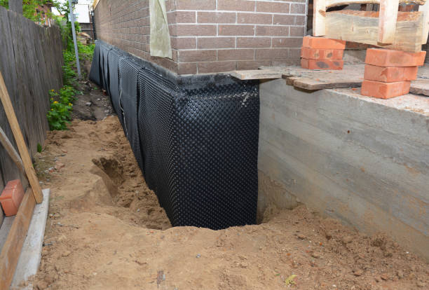 Happy homeowners after waterproofing job in Ludlow Falls